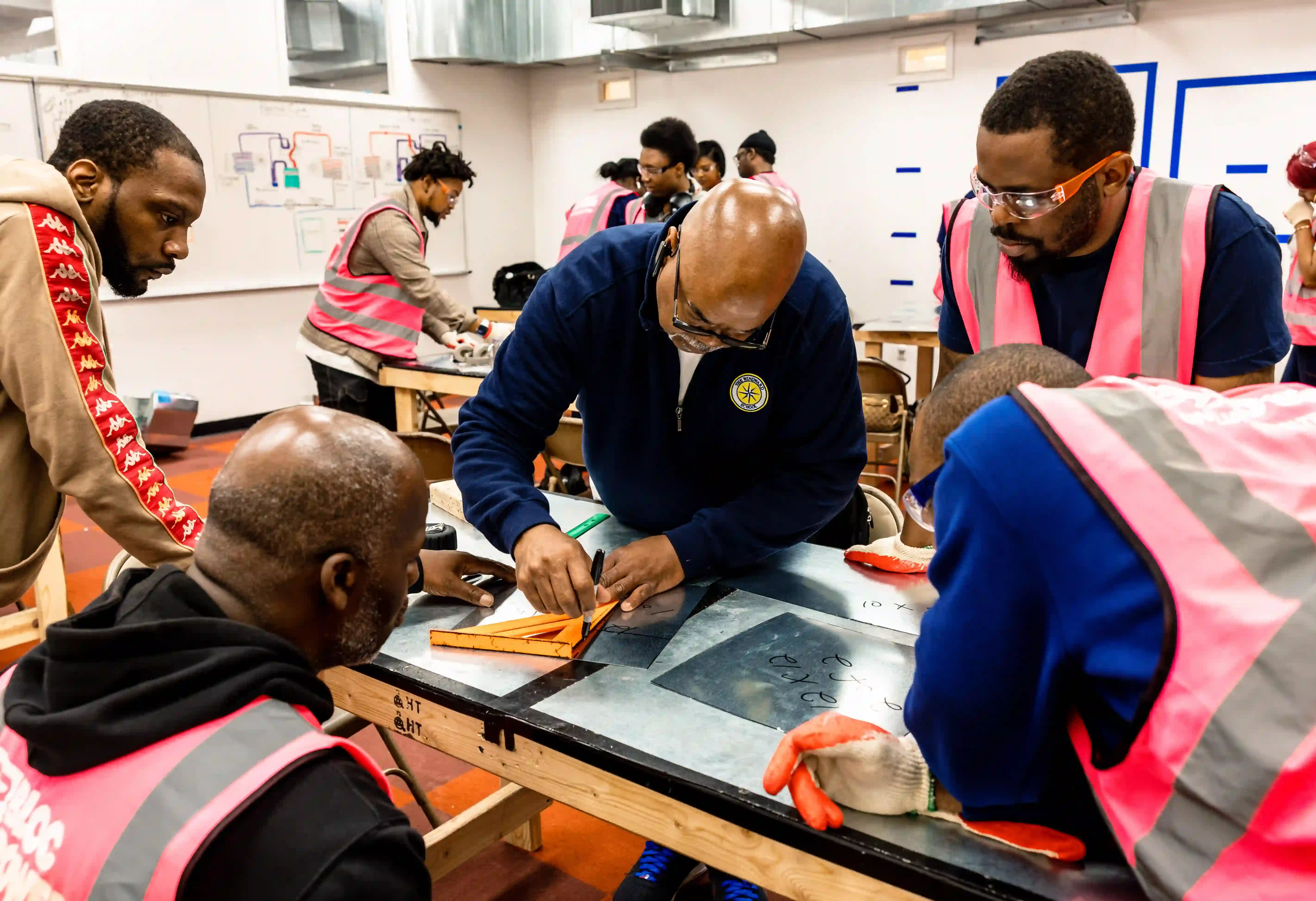 Blocpower workforce trainees being trained in a classroom